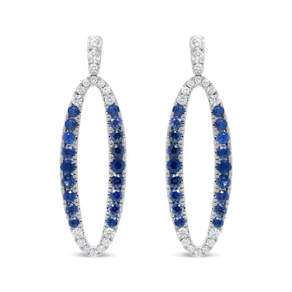 View details for 18K White Gold 1.11 Cttw Blue Round Diamond and Blue Sapphire Openwork Oval Shaped Dangle Earrings (F-G Color, VS1-VS2 Clarity) 18K White Gold 1.11 Cttw Blue Round Diamond and Blue Sapphire Openwork Oval Shaped Dangle Earrings (F-G Color,